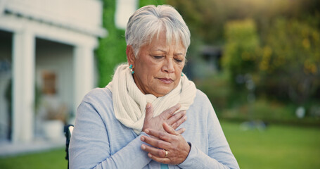 Heart attack, pain and senior woman in a garden with hands on chest, anxiety or breathing problem. Cardiac arrest, stress and old lady outdoor retirement home with asthma, heartburn or lung disease