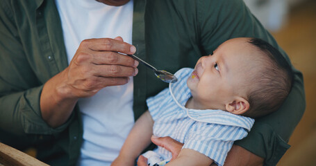Man, feed and baby or food closeup with spoon as nutrition meal, health or cooking. Male person, hand and childhood development or parent love connect for dinner diet or growth, happy kid or vitamin