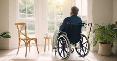 Wheelchair, old man or thinking of memory by window in nursing home or retirement with depression. Nostalgia, sad or lonely elderly person in living room by an empty chair to remember past loss - obrazy, fototapety, plakaty