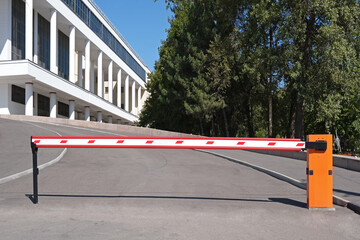 Automatic barrier at the entrance to the parking lot near the public building.