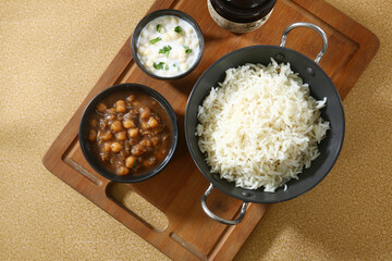 Chole Chawal or Chole Masala Rice With Raita, Indian dish