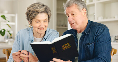 Bible study, reading and senior couple in home with Christian worship, prayer and education in faith. Elderly, people and studying holy gospel, religion or trust in God and together in retirement