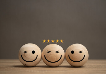 concept of service satisfaction A smiley face ball is placed on the table and there is a gold star...