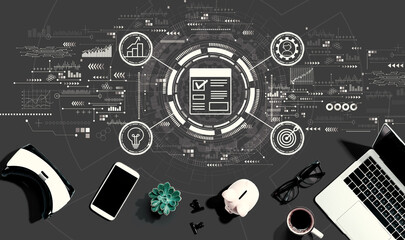 Project management theme with electronic gadgets and office supplies - flat lay