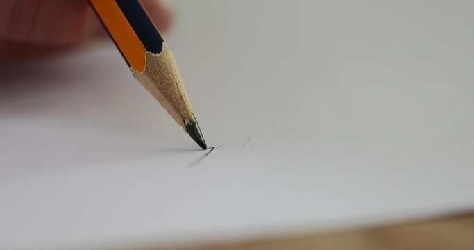 Woman hand draws picture and pencil breaks