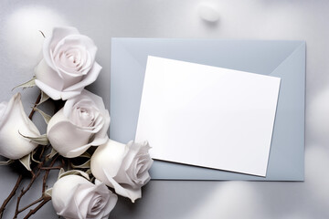 white roses and blank card
