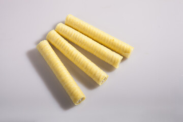 Yellow filled tubes isolated on white background