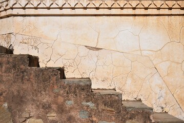 Abstract of narrow stair case Composition that is creating optical illusion in Kumbhalgarh fort. It...