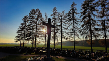Cemetery in Dziewkowice - graves, cross, trees and sun - obrazy, fototapety, plakaty