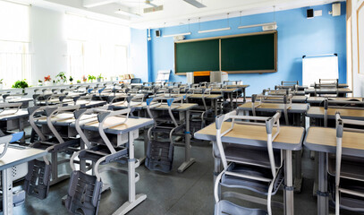 Fototapeta na wymiar School classroom with desks and chairs