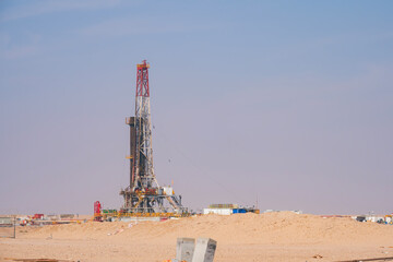 Onshore Oil Drilling Rig, in desert area. Industrial Marvel in Offshore Energy Exploration and Petroleum Production. Oil drilling and work over rig in desert isolated....