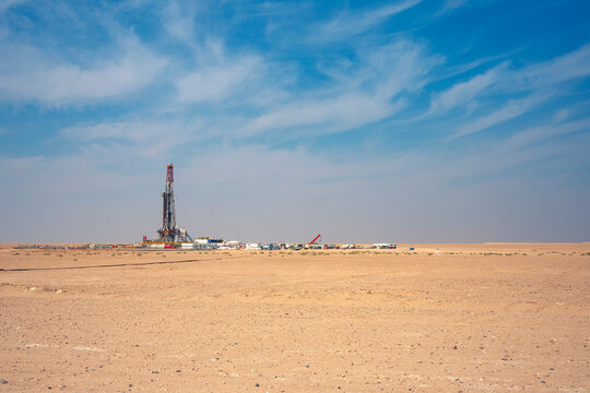 Onshore Oil Drilling Rig, in desert area. Industrial Marvel in Offshore Energy Exploration and Petroleum Production. Oil drilling and work over rig in desert isolated.