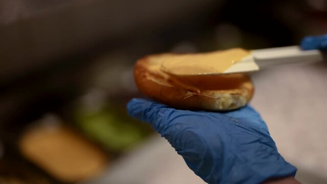 closeup view of cooking hamburger process in kitchens of fast food restaurant