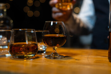 Barman pouring whiskey whiskey glass..