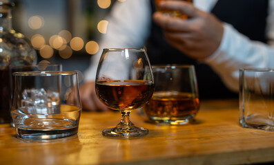 Businessman wearing a suit whiskey glass of liquor.