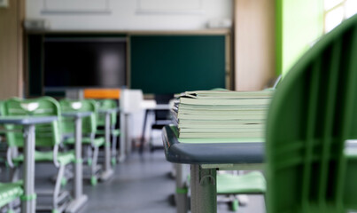 Stack of books on the desks