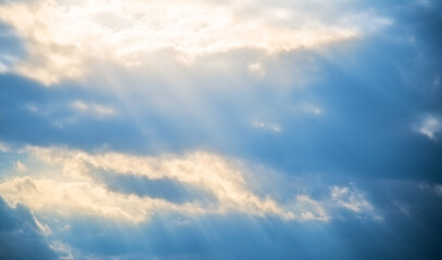 Naklejka na ściany i meble Background of sunlight through clouds