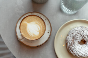 Delicious morning breakfast background with curd ring and coffee on a table