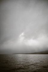 Dramatic vertical landscape of water and gray clouds at Lake Tahoe