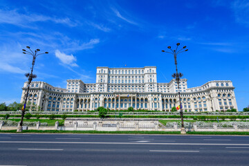 The Palace of the Parliament also known as People's House (Casa Popoprului) in Constitutiei Square (Piata Constitutiei) in Bucharest, Romania, in a sunny spring day.