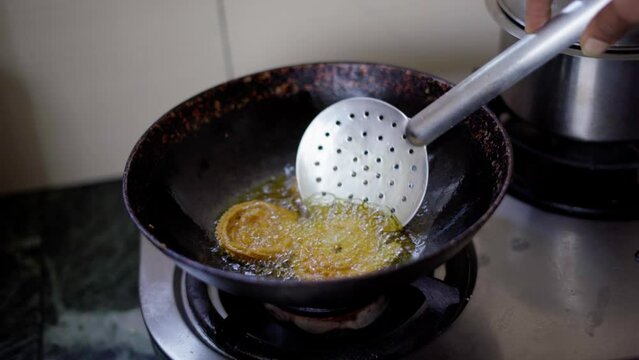 Indian woman making chakli an Diwali snack for Diwali festival 