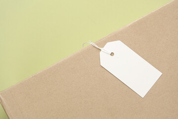 White empty tag with string on box. Template for design