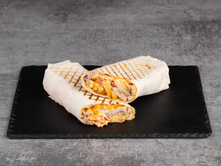 Chicken shawarma, fresh roll, grilled meat wrap and lettuce wrap with white sauce. Turkish Doner Kebab on pita bread - Shawarma chicken.