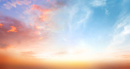 amazing panoramic sunrise or sunset sky with gentle colorful clouds.