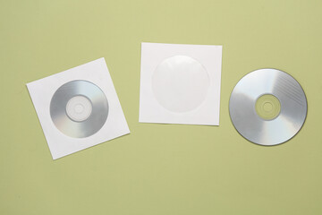 Mockup of CD discs in Paper packs on pastel background