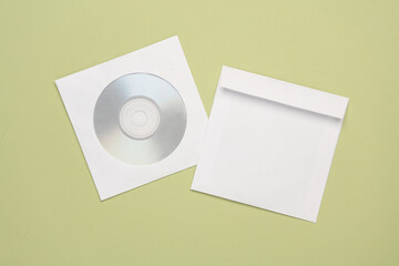 Mockup of CD disc in Paper pack on pastel background