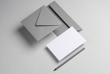 Floating envelopes and card on gray background with shadow. Minimalism, modern business still life,...
