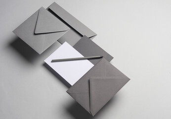 Floating envelopes and card on gray background with shadow. Minimalism, modern business still life,...