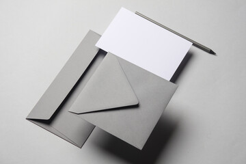 Floating envelopes and card on gray background with shadow. Minimalism, modern business still life,...