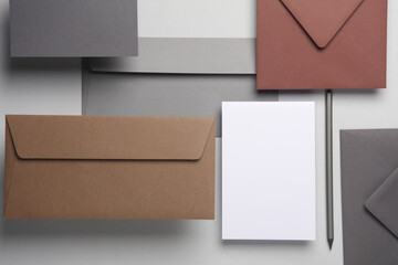 Floating envelopes and card on gray background with shadow. Minimalism, modern business still life,...