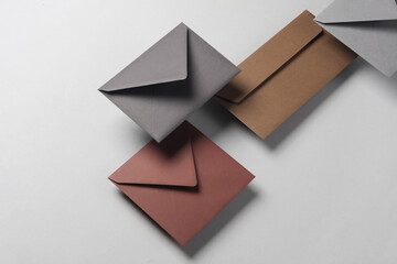 Floating envelopes on gray background with shadow. Minimalism, modern business still life, creative layout