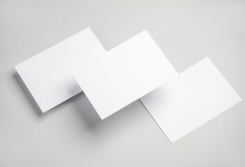Floating blank white cards on gray background with shadow. Minimalism, modern business still life,...