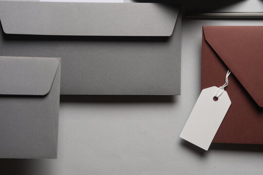 Floating envelopes and brochure, cards on gray background with shadow. Minimalism, modern business still life, creative layout