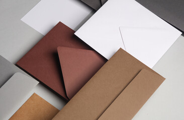 Floating envelopes and cards on gray background with shadow. Minimalism, modern business still life, creative layout
