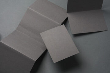 Brochures or cards on dark gray background