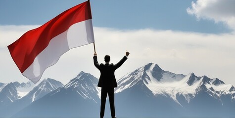 Smart businessman professional holding a flag Indonesia for success invest business standing on top of mountain