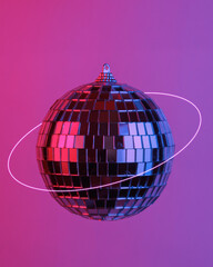 Disco ball floating in the air, isolated in blue-red neon gradient light. Levitating objects. Party...