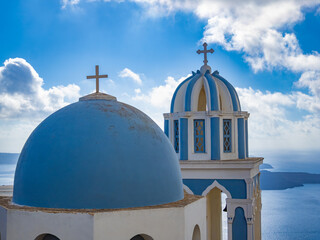 Typical orthodox greek church in Santorini (officially Thira and Classical Greek Thera) island, Cyclades islands, Aegean Sea, Greece - obrazy, fototapety, plakaty