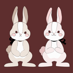 正面を向いたリボンを付けたかわいいウサギのペア