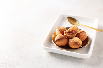 Cookies Nuts in a bowl on a light background