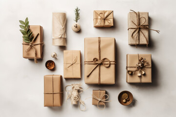 Top view of many craft gift boxes with paper decorations on light background. Christmas, New year content