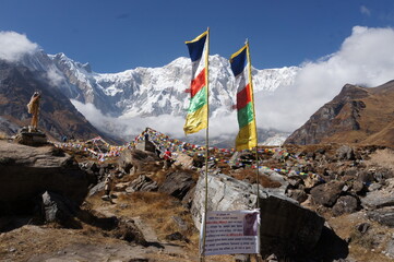 Tibetan prayer flags and stone graves in Annapurna base camp, Nepal