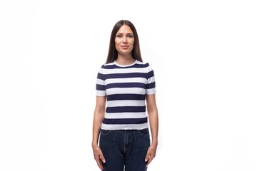 pretty slim young brunette woman in a striped t-shirt on a white background with copy space