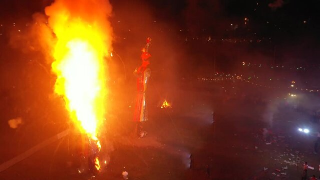 A drone shot of a Ravana's idol being burned at the dussehra festival in India

