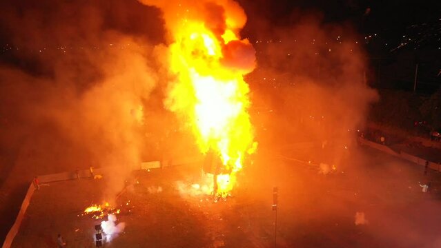 A drone shot of a Ravana's idol being burned at the dussehra festival in India

