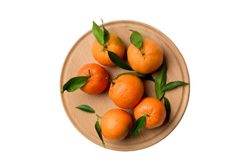 Fresh cutted clementines and whole mandarin over round plate isolated on white background. Food and drink ingredients preparing. healthy eating theme top view with copy space